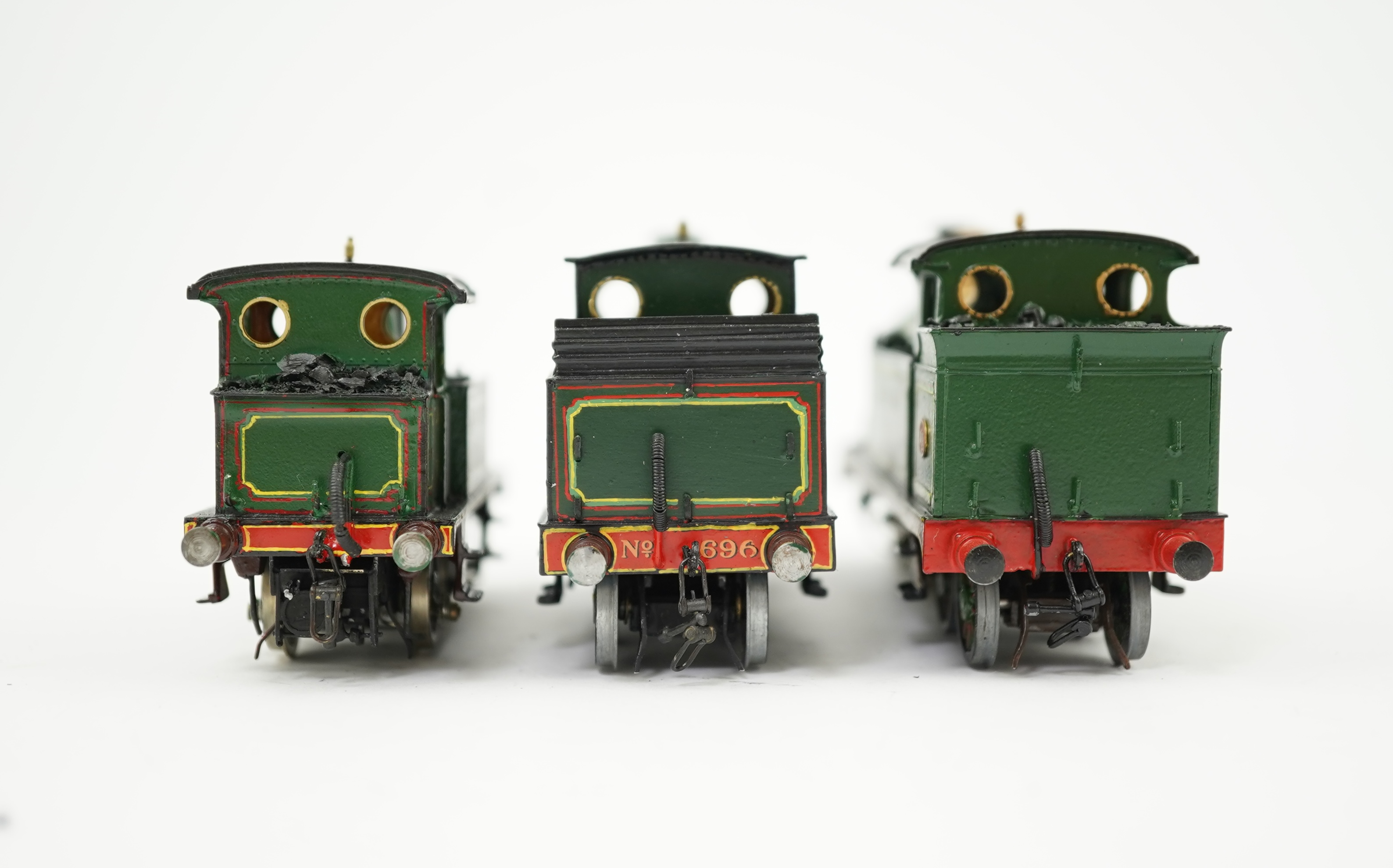 Three 00 gauge brass and white metal kit built Wainwright designed SE&CR tank locomotives (possibly by Wills Finecast); a class R1 0-4-4T, 696, a class H 0-4-4T, 263, and a class P 0-6-0T, 325, constructed, all painted a